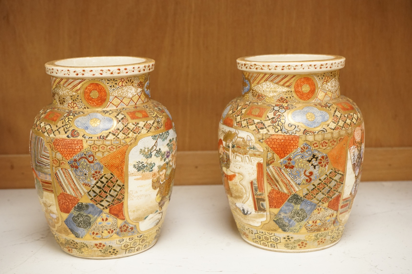 A pair of Japanese Satsuma 'Boys' vases, Meiji period, 17.5cm